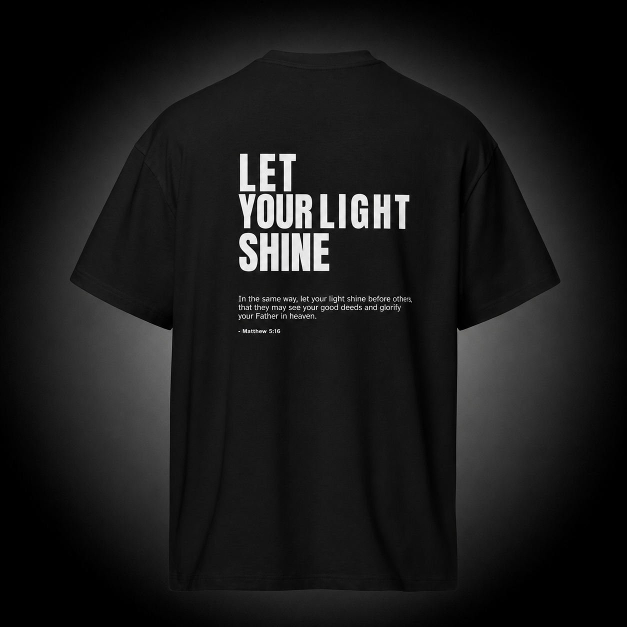 Unashamed Christian T-Shirt featuring Matthew 5:16 Bible verse "Let Your Light Shine" design on a premium black cotton tee